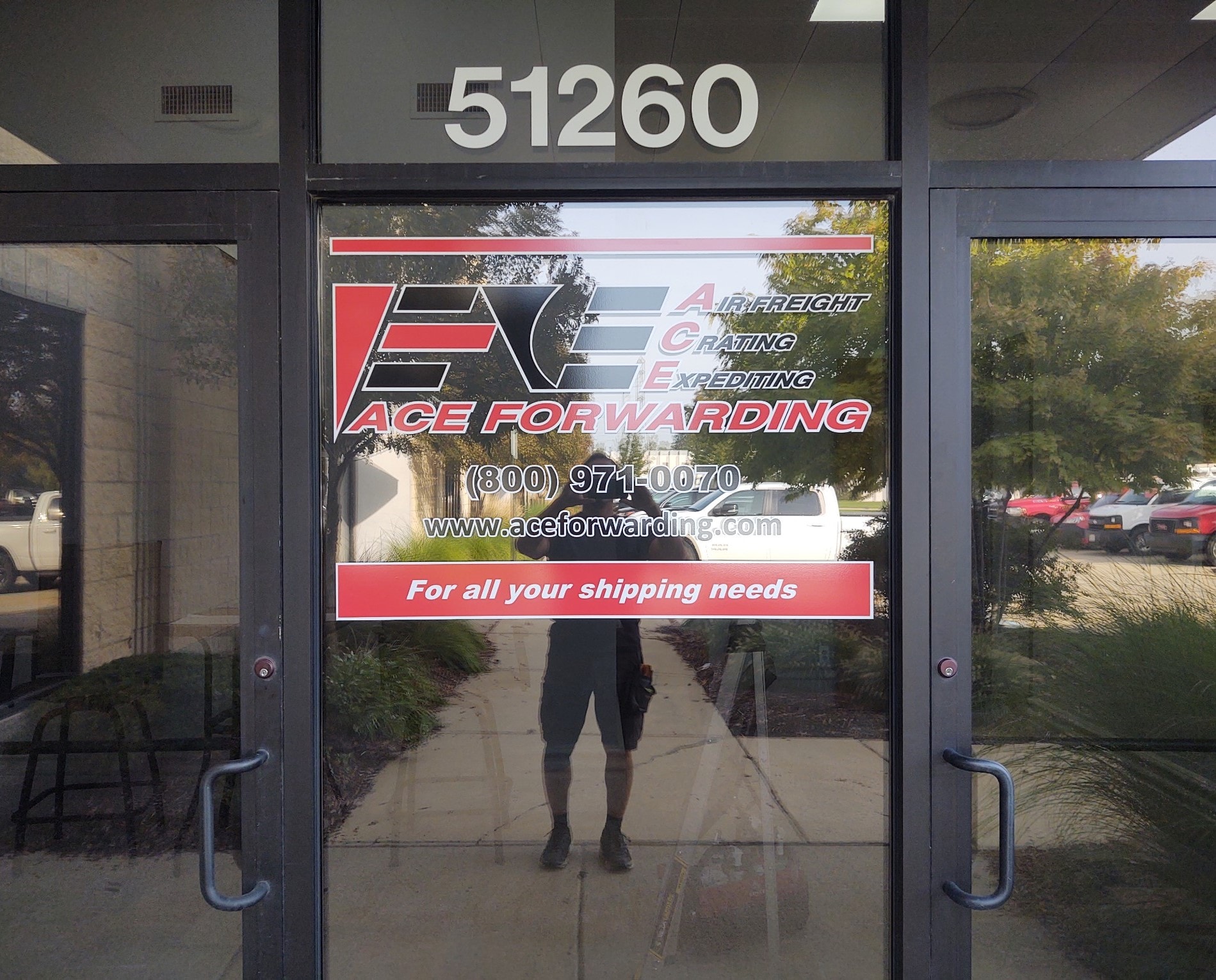 Ace Forwarding storefront door graphics