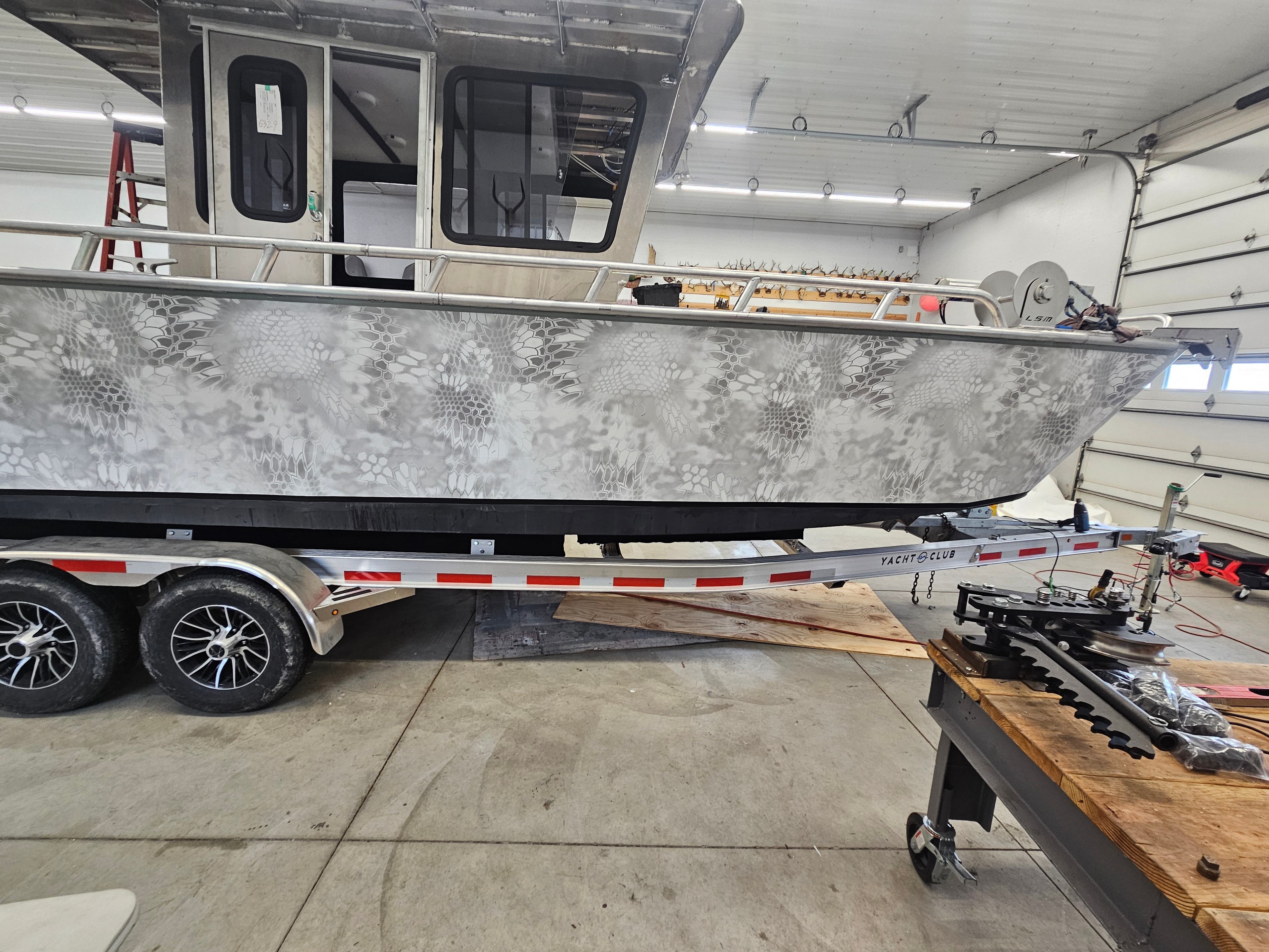 Close-up detail of a custom camouflage boat wrap
