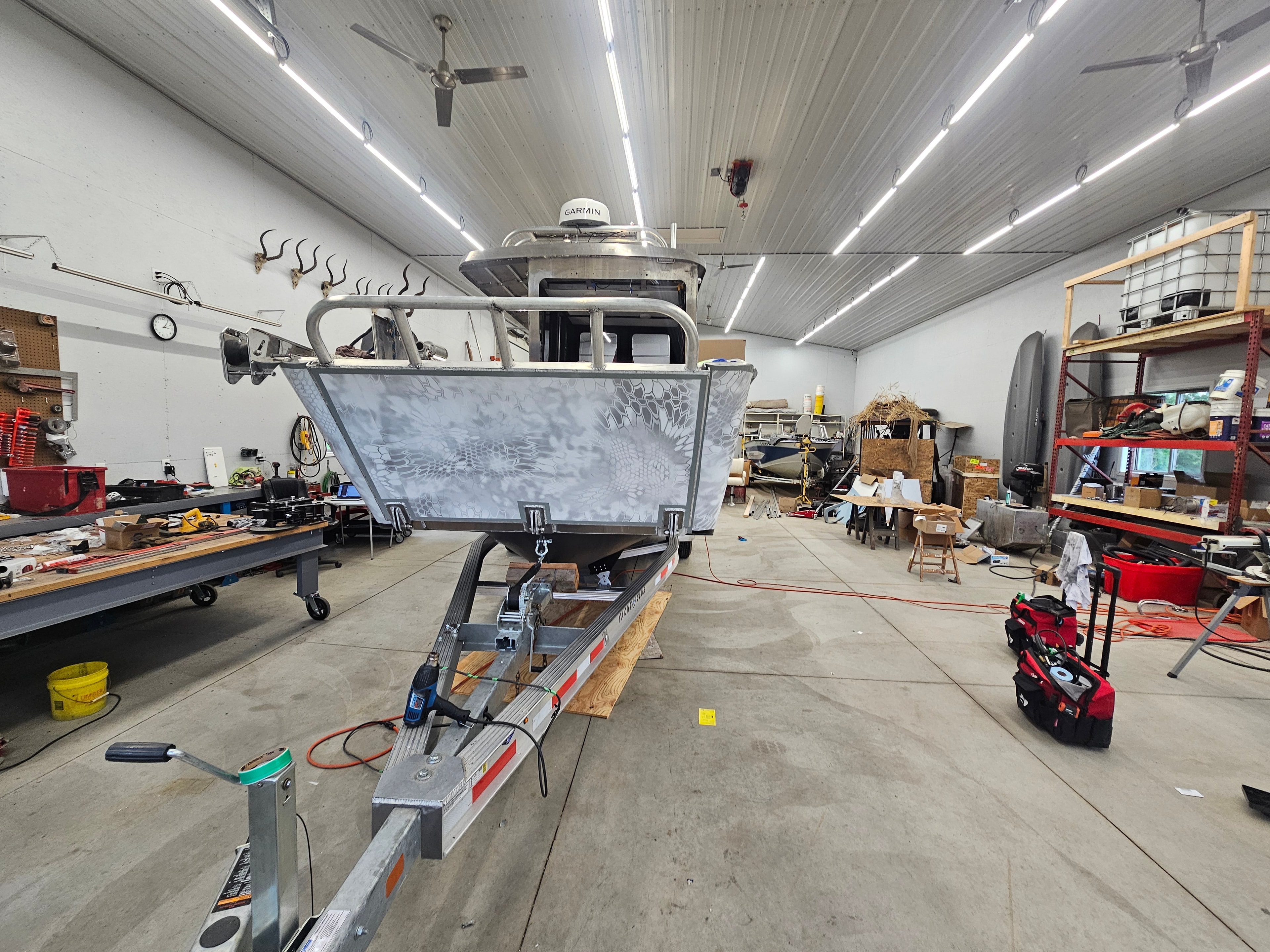 Front view of a custom camouflage boat wrap
