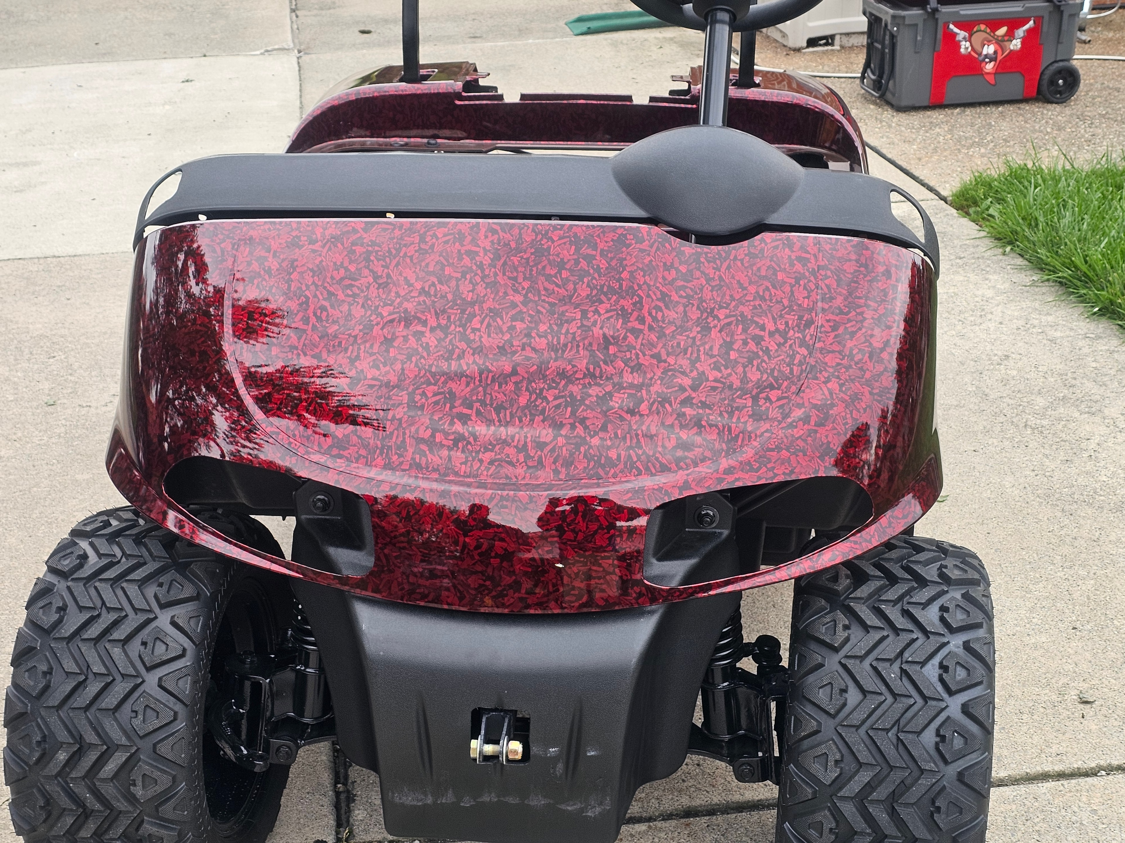 Front view of a maroon custom golf cart wrap