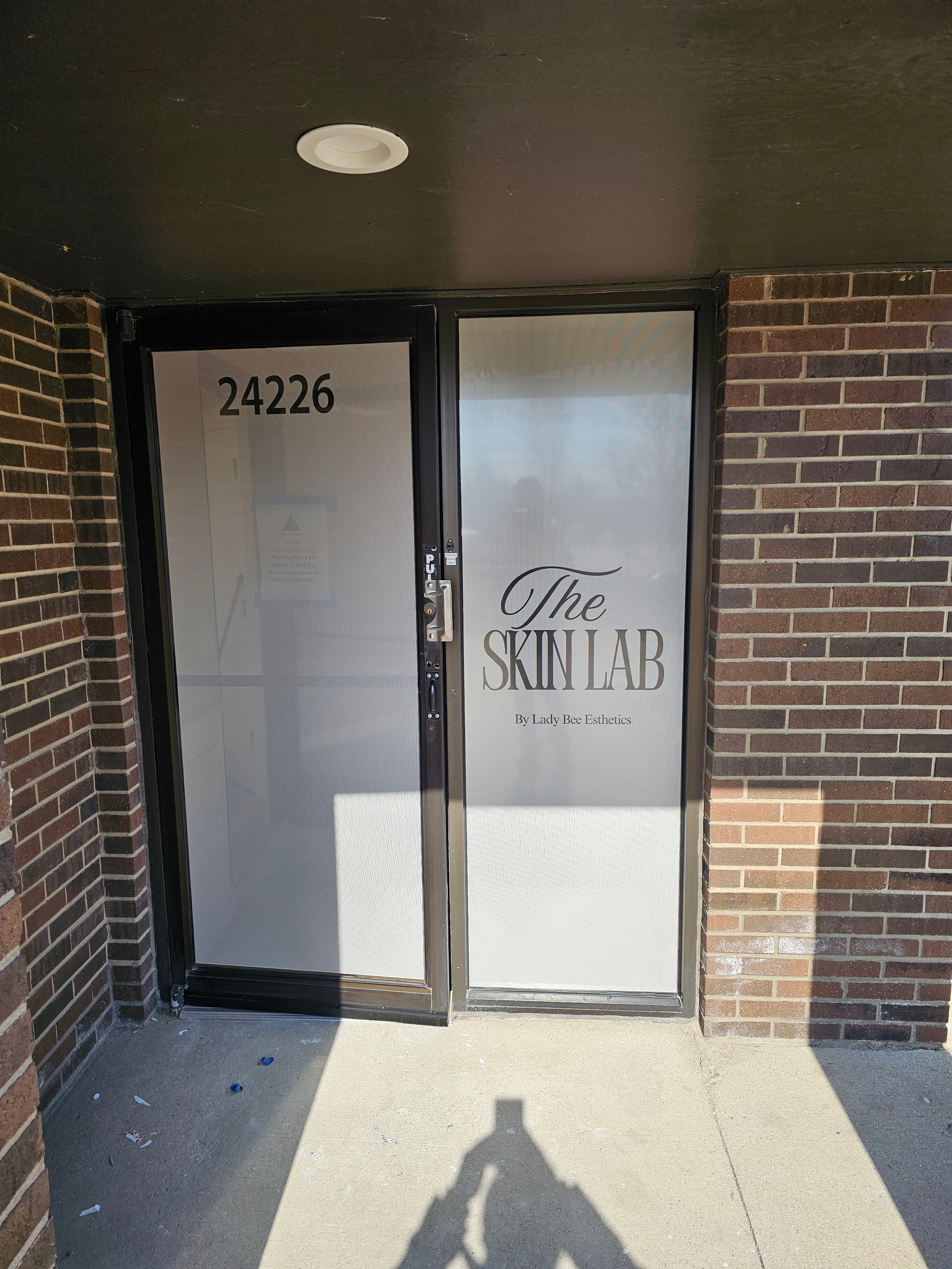 The Skin Lab storefront door vinyl graphics